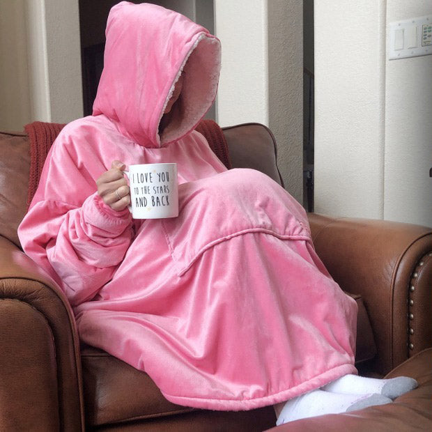 Woman wearing pink comfy wearable blanket